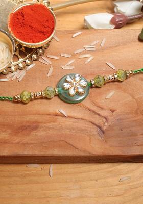 Grey And Silver Toned Stone Studded Floral Rakhi