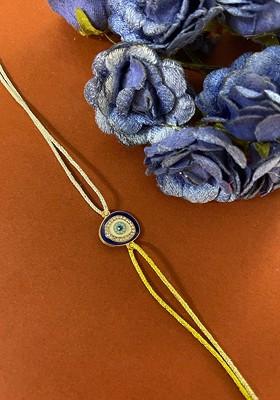 Men Yellow American Diamond Studded Evil Eye Rakhi