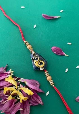 Men Red And Blue Beaded And Lord Ganesh And Om Charm Rakhi With Roli