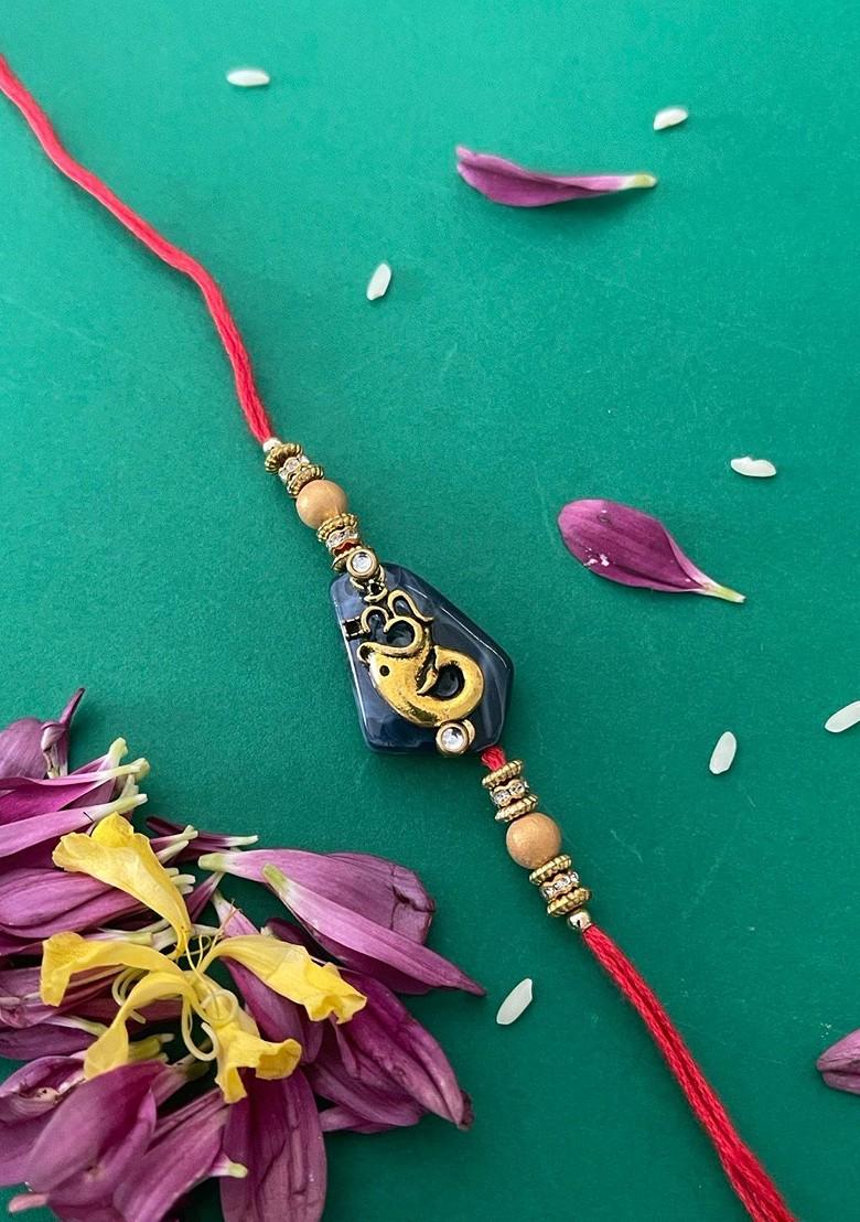 Men Red And Blue Beaded And Lord Ganesh And Om Charm Rakhi With Roli