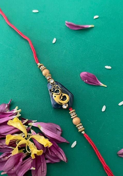 Men Red And Blue Beaded And Lord Ganesh And Om Charm Rakhi With Roli