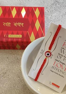 Red And Gold Toned Beaded Thread Rakhi And Greeting Card Set