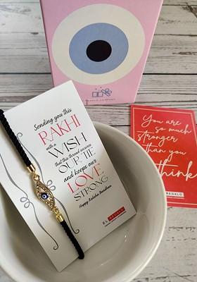 Evil Eye Rakhi Combo For Bhaiya With Roli Chawal Shagun And Greeting Card