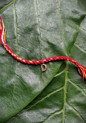Men Gold Plated Red And Yellow Ad Studded D Alphabet Customized Thread Rakhi
