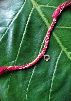 Men Gold Plated Red And Yellow Ad Studded O Alphabet Customized Thread Rakhi