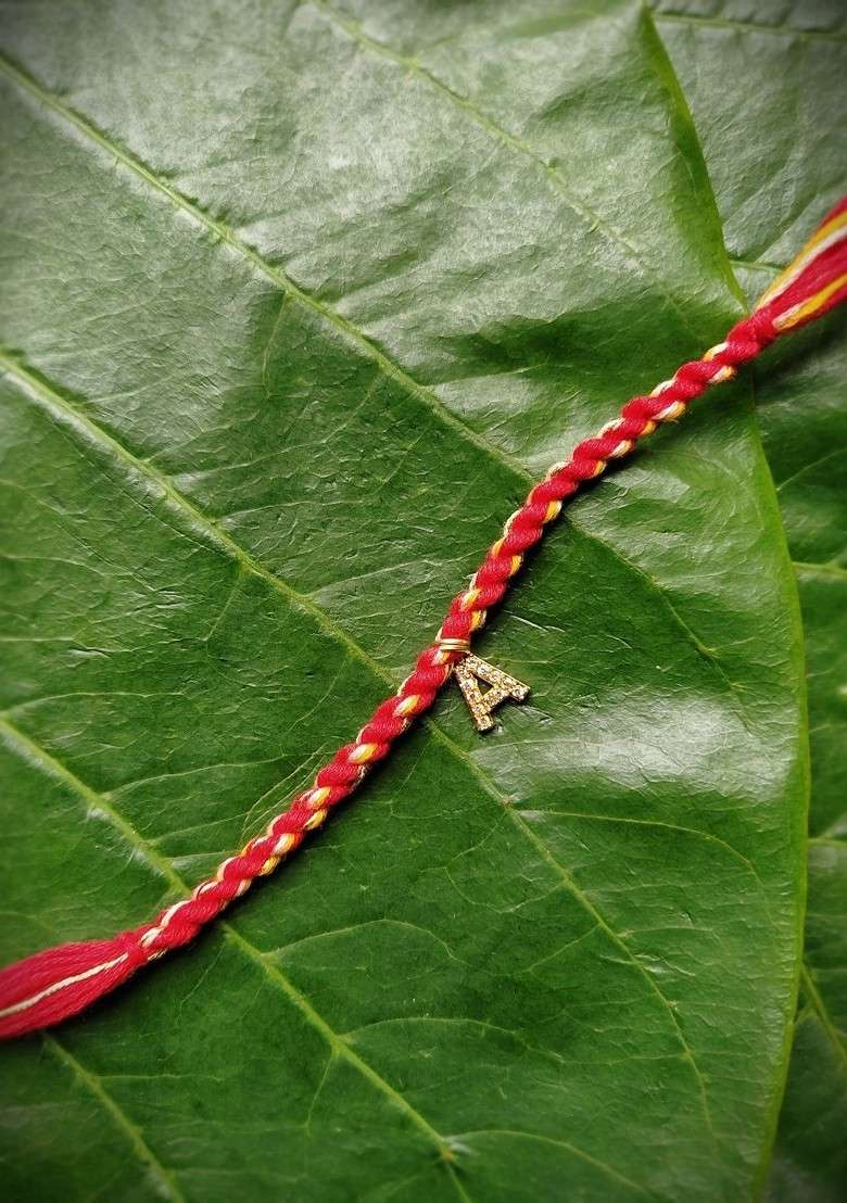 Men Gold Plated White And Red Ad Studded A Alphabet Customized Thread Rakhi - Indya