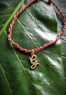 Men Gold Toned And White Ad Studded Customized Letter G Rakhi