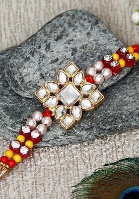 Gold Toned And Red Designer Stone Work Rakhi And Roli Chawal Pack