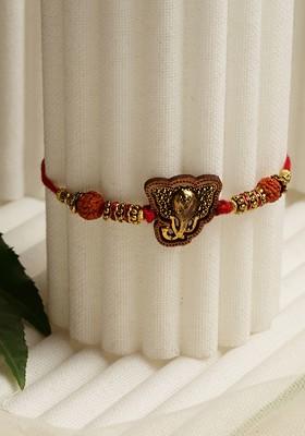 Gold Toned Rudraksha Beads Traditional Ganpati Rakhi With Roli Chawal
