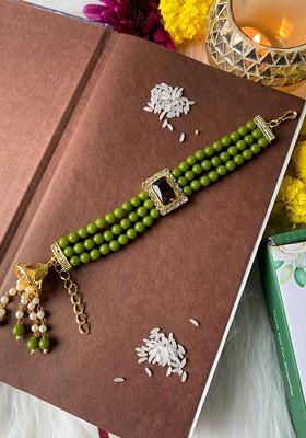 Women Stone Studded And Beaded Lumba Rakhi
