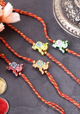 Set Of 4 Unisex Gold Plated Elephant Shaped Thread Rakhis With Roli Chawal