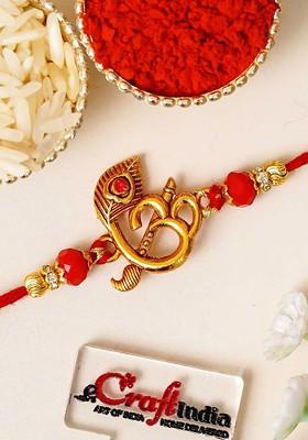 Stones Studded Peacock Feather Flute Om Design Thread Rakhi