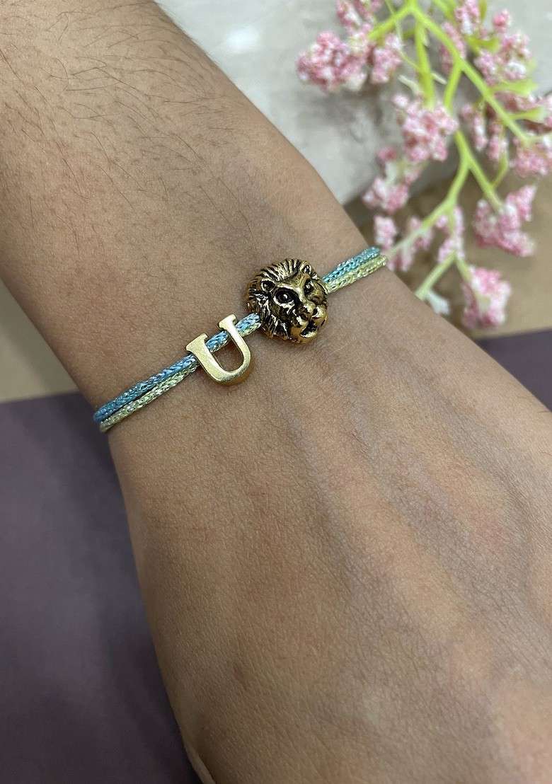 U Letter Lion Charm Thread Rakhi - Indya