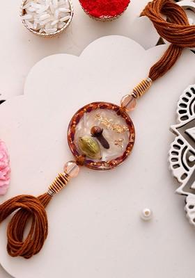 Laung And Elaichi Resin Thread Rakhi With Roli Chawal And Greetings Card