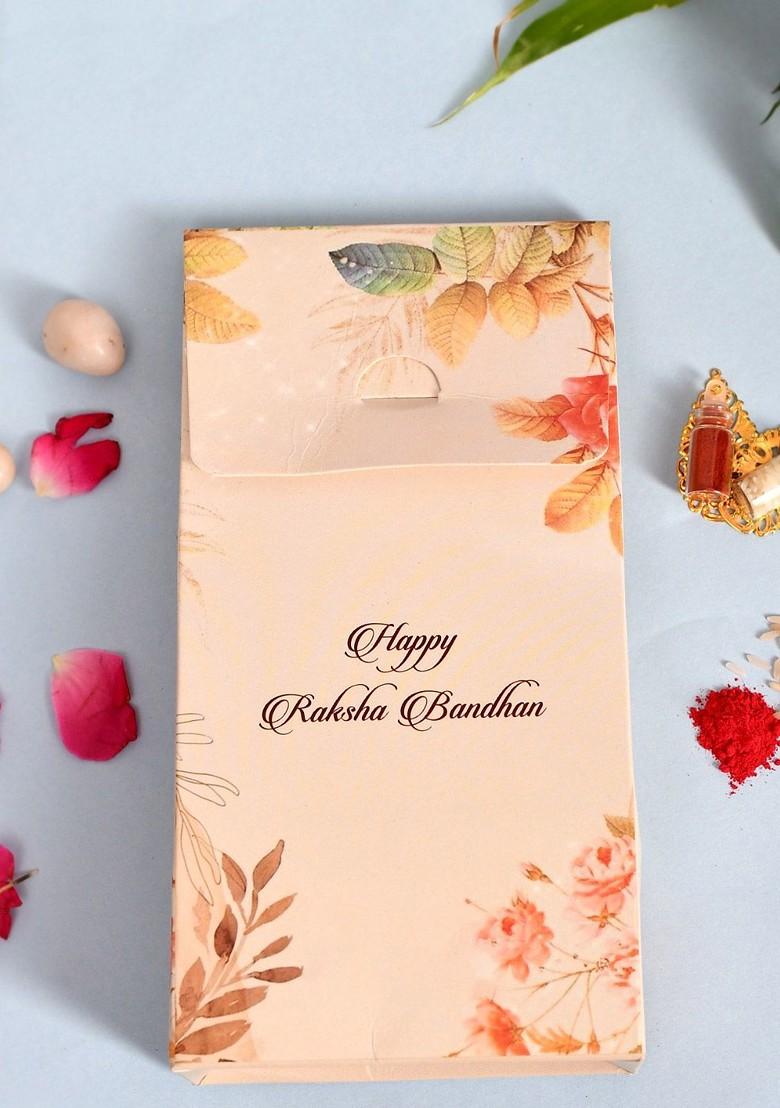 Gold Toned Pearl Embellished Lumba Rakhi With Roli Chawal And Greeting Card