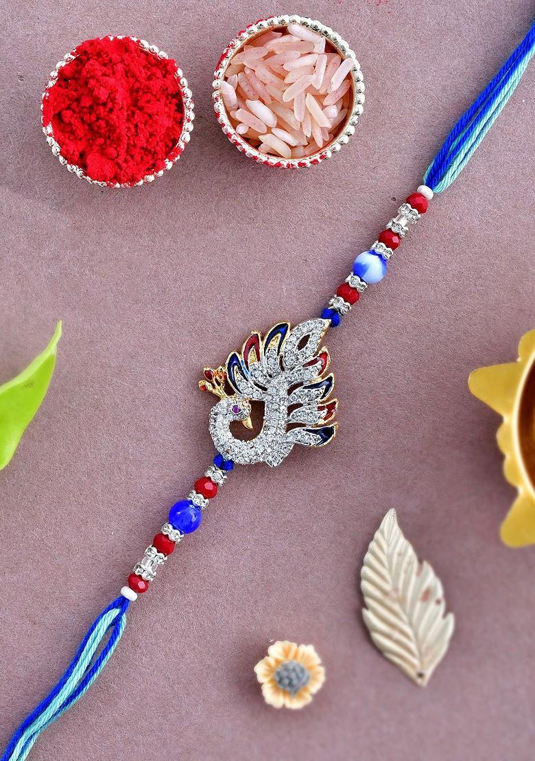 Blue Swarowski Embellished Peacock Thread Rakhi With Roli Chawal And Greeting Card