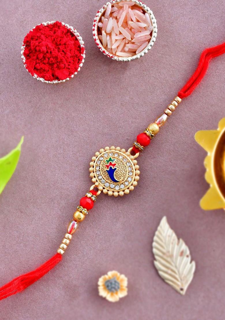 Gold Toned Stone Studded And Beaded Rakhi With Roli Chawal And Greeting Card