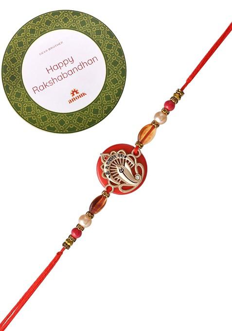 Red Resin Based Ganesha Rakhi With Roli Chawal And Greeting Card