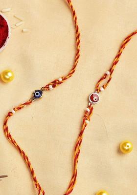 Set Of 2 Evil Eye Rakhis With Rholi Chawal And Greeting Card