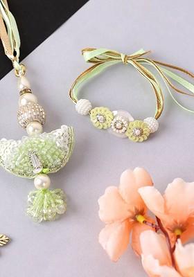 Set Of 2 Gold Plated Studded Lumba Rakhis With Roli Chawal