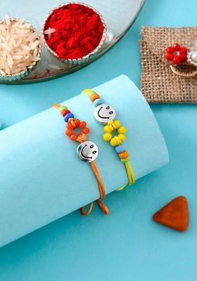 Unisex Set Of 2 Smiley With Beaded Rakhis With Roli Chawal And Greeting Card