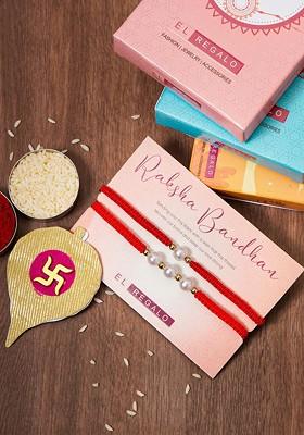 Set Of 2 Pearl Rakhi Combo For Bhaiya And Bhabhi With Roli Rice
