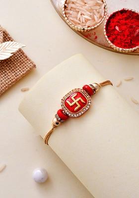 Gold Plated Swastik Embossed Gemstone Based Traditional Rakhi