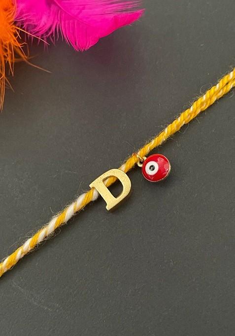 Gold Plated D Alphabet And Evil Eye Charm Rakhi