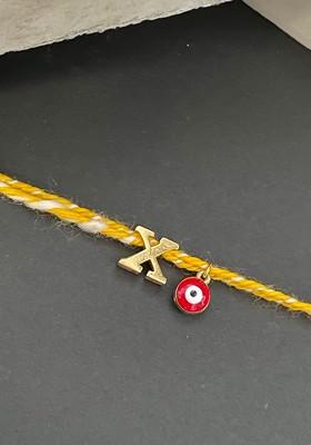 Gold Plated X Alphabet And Evil Eye Charm Rakhi
