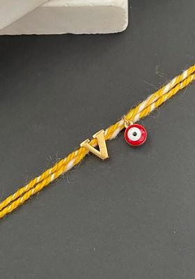 Gold Plated V Alphabet And Evil Eye Charm Rakhi