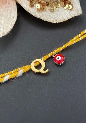 Gold Plated Q Alphabet And Evil Eye Charm Rakhi