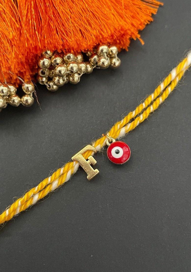 Gold Plated Letter F Initial And Evil Eye Charm Rakhi - Indya