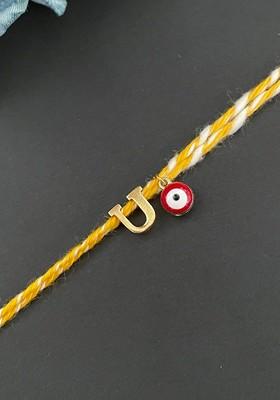 Gold Plated U Alphabet And Evil Eye Charm Rakhi