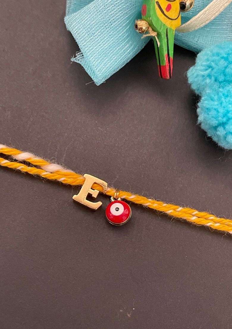Gold Plated E Alphabet And Evil Eye Charm Rakhi - Indya