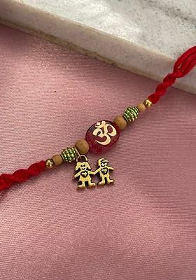 Om With Brother And Sister Charm Rakhi