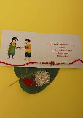 Butterfly Charm Beaded Rakhi Greeting Card And Roli Chawal