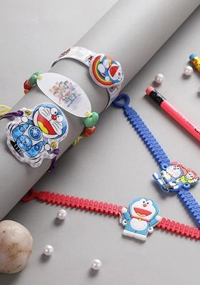 Set Of 5 Blue And White Doremon Charm Rakhi With Roli Rice And Rakhi Card