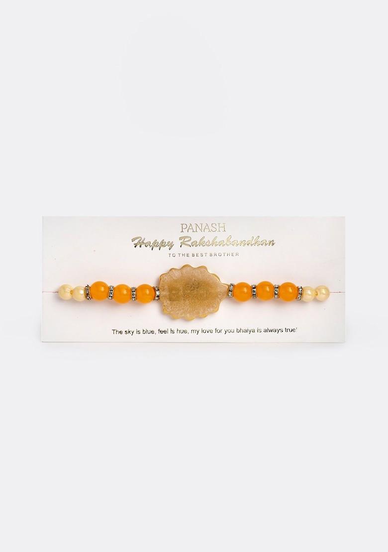 Gold Plated Yellow Pearls Bro Rakhi With Gift Stand - Indya
