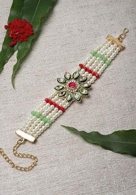 Gold Toned And White Kundan And Pearls Bracelet Style Rakhi With Roli Chawal