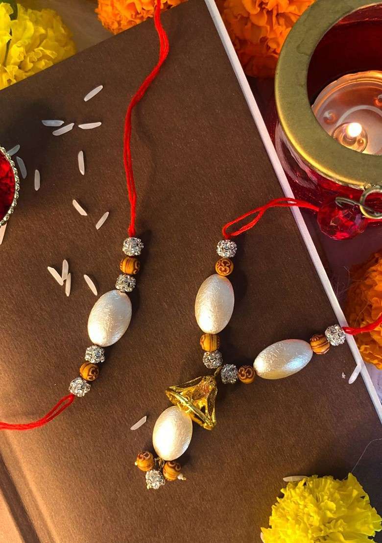 White And Red Pearl Studded Bhaiya Bhabhi Hanging Lumba Rakhi - Indya