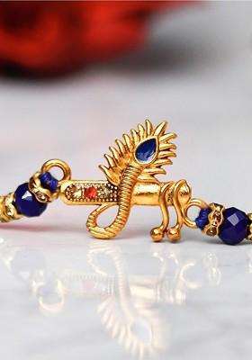 Gold Toned And Blue Rakhi Gift Set