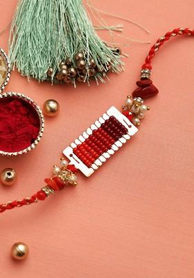 Red And Silver Toned Beads With Uncut Coral Jeweled Rakhi Set