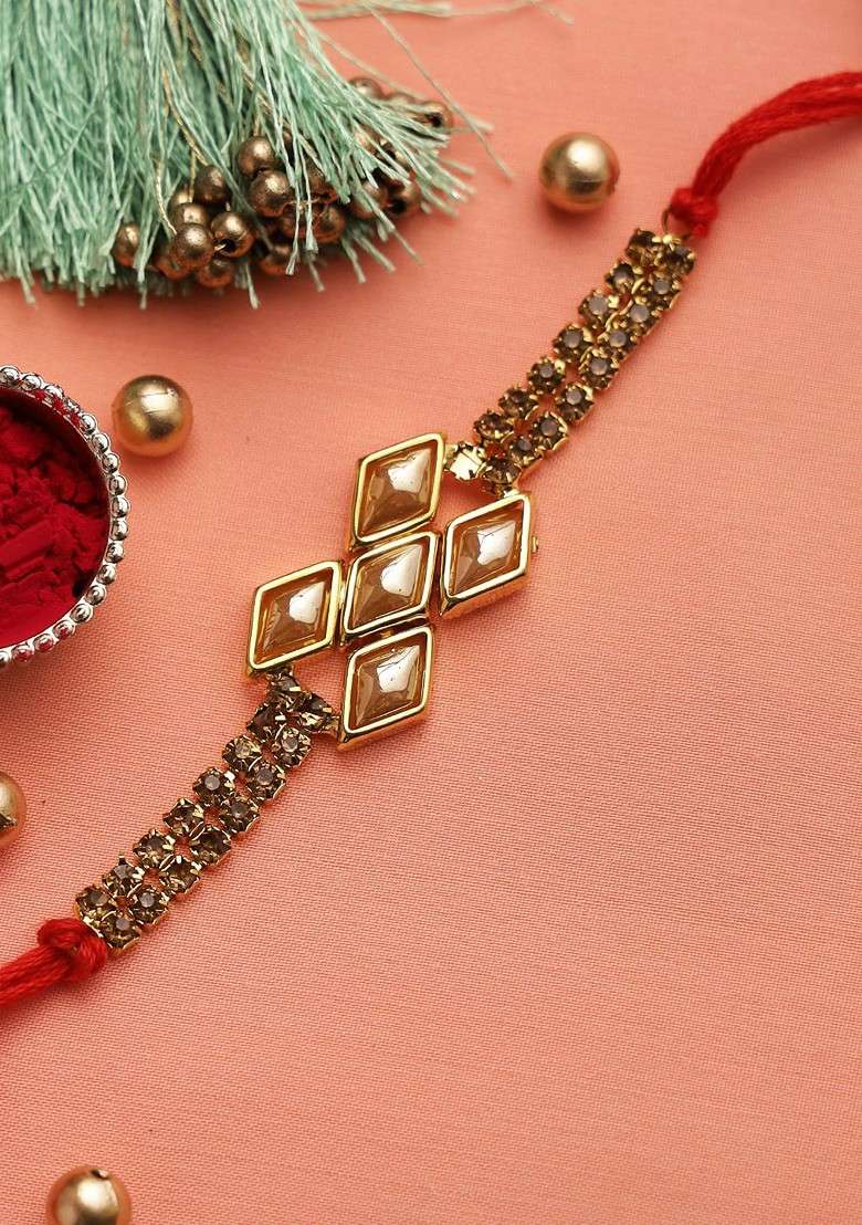 Adults Gold Toned And Red Handcrafted Uncut Diamonds Bracelet Style Rakhi - Indya