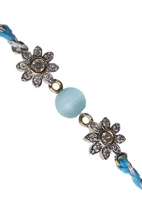 Turquoise Blue Floral Ad Studded Rakhi With Roli Chawal And Card