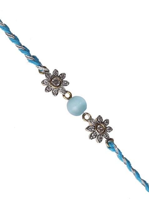 Turquoise Blue Floral Ad Studded Rakhi With Roli Chawal And Card
