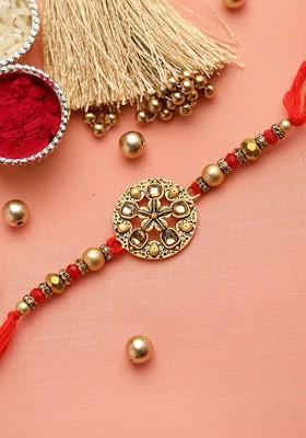 Red And Gold Toned Stone Studded And Beaded Rakhi