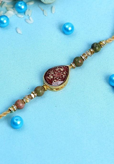 Maroon Stone Studded And Beads Lucky Charm Thread Rakhi