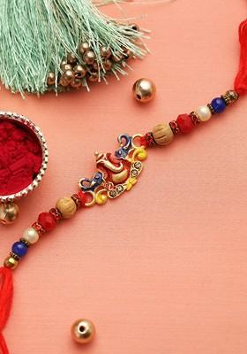 Gold Toned And Red Lord Ganapati Motif Beaded Rakhi