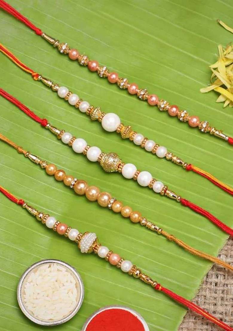 Set Of 5 White And Golden Pearls Rakhis With Roli Chawal Pack - Indya