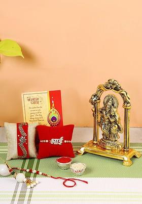Set Of 4 Rakhi With Gold Plated Radha Krishna Idol